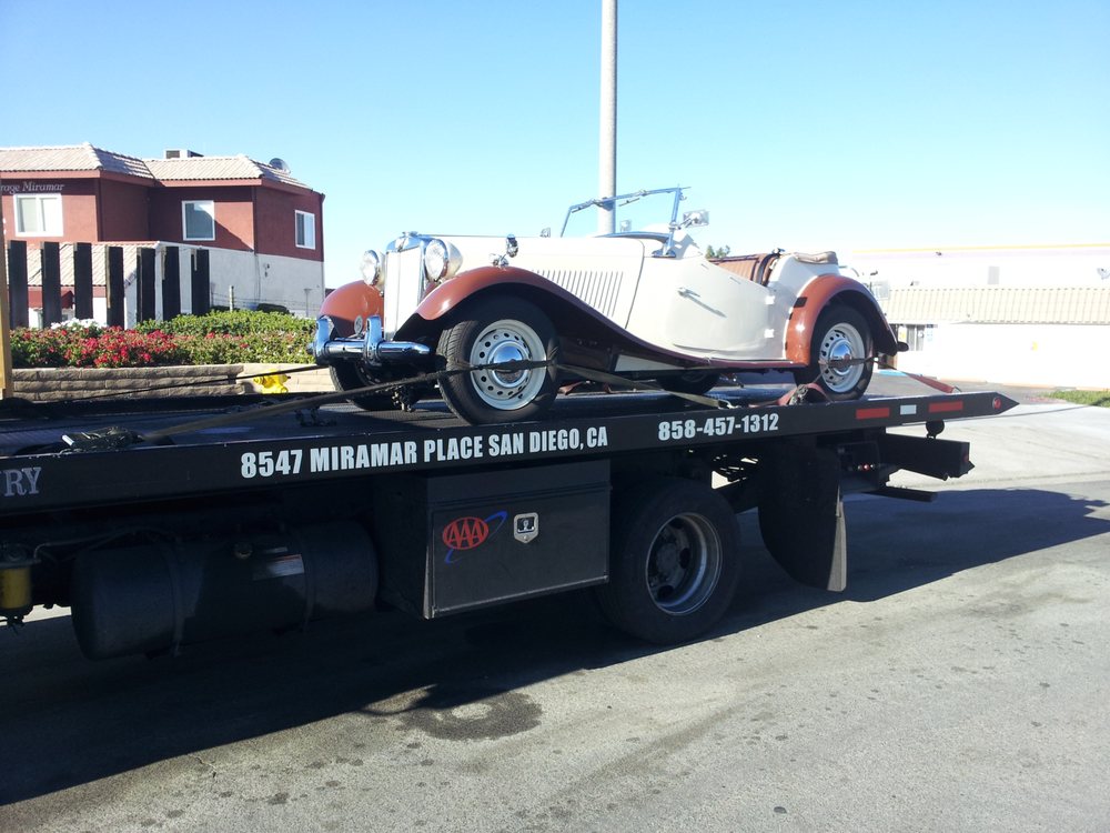 vintage car on tow truck