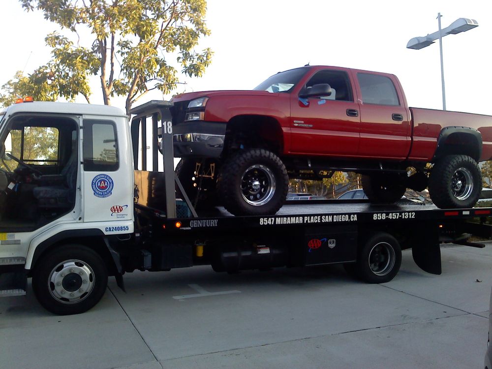 red truck on tow truck