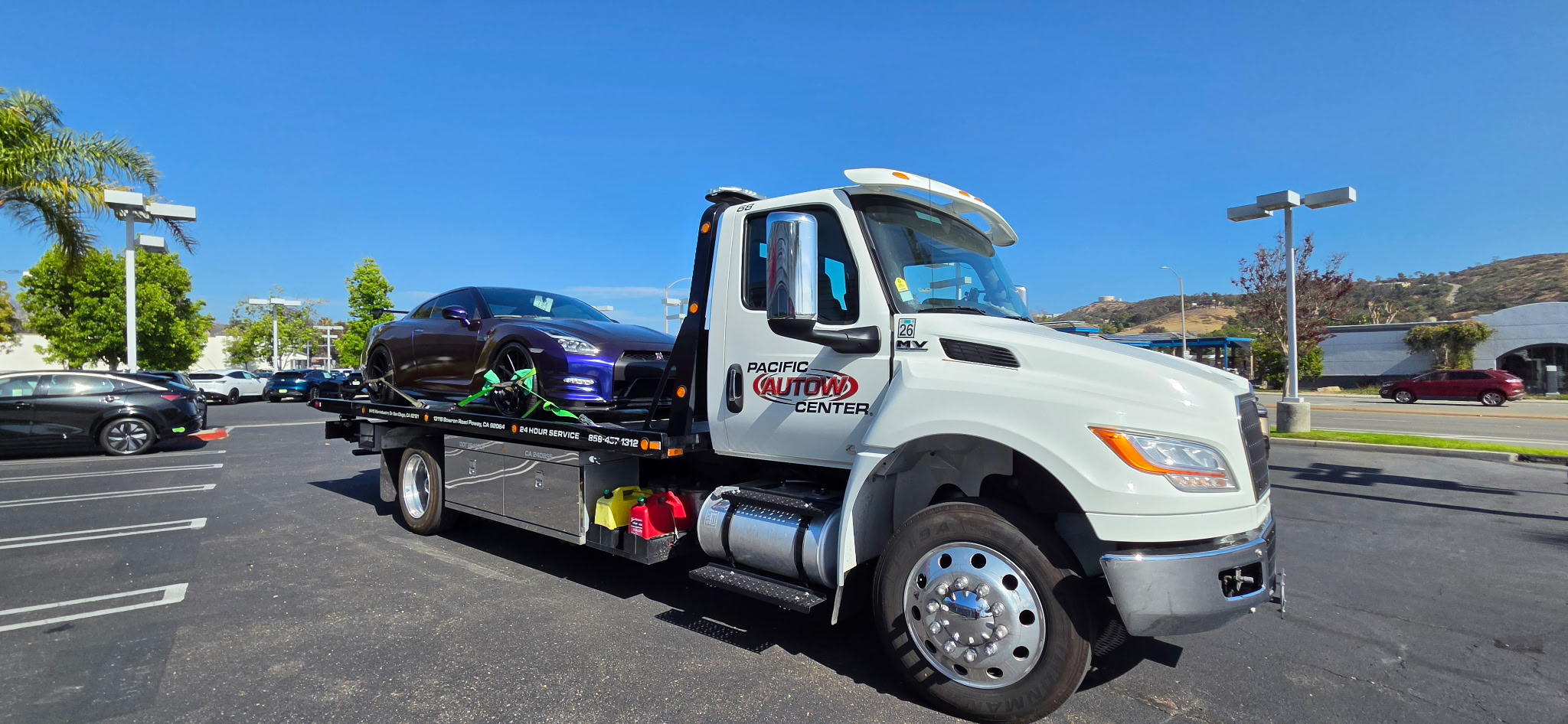 white flatbed  tow truck