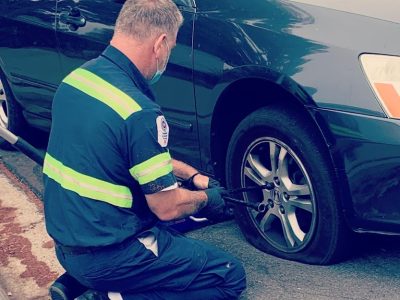 technician fixing a tire